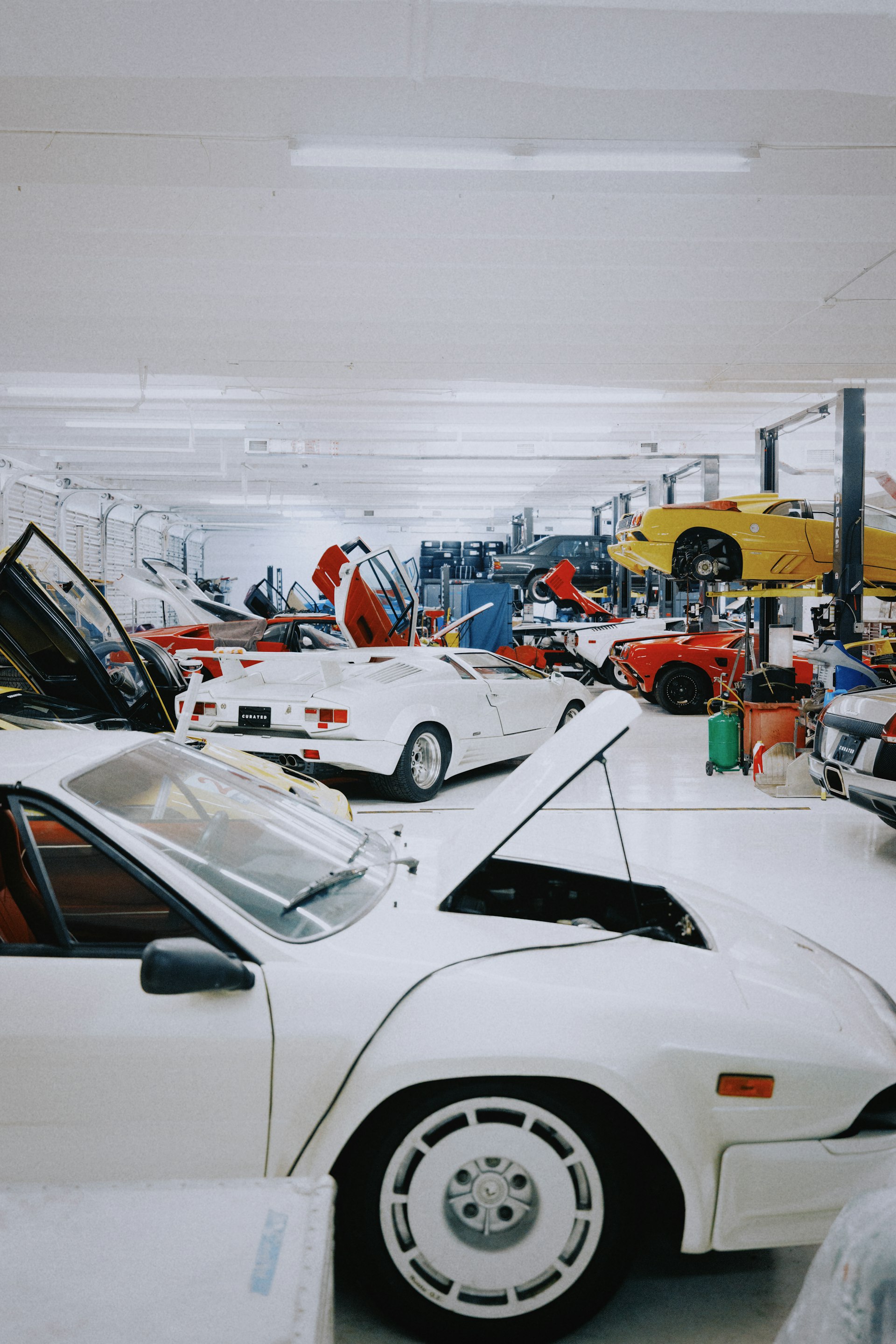 AUTOEXPERT auto repair shop bay in Virginia Beach, VA, full of vehicles being serviced